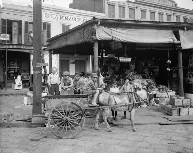 ca. 1910 - Kids at the French Market